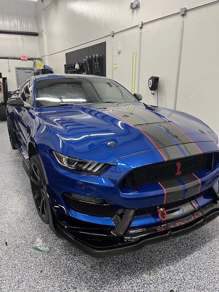 Blue Ford Mustang after auto glass service